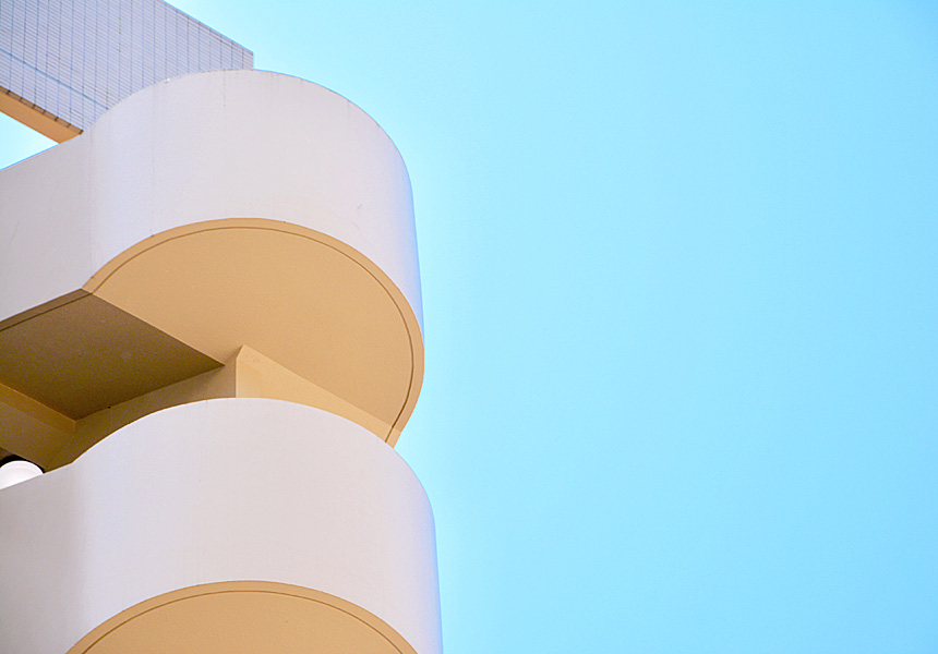 A white building with a blue sky